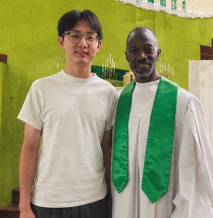 Hongbai Zhu (Joe) with pastor of First Church of Deliverance